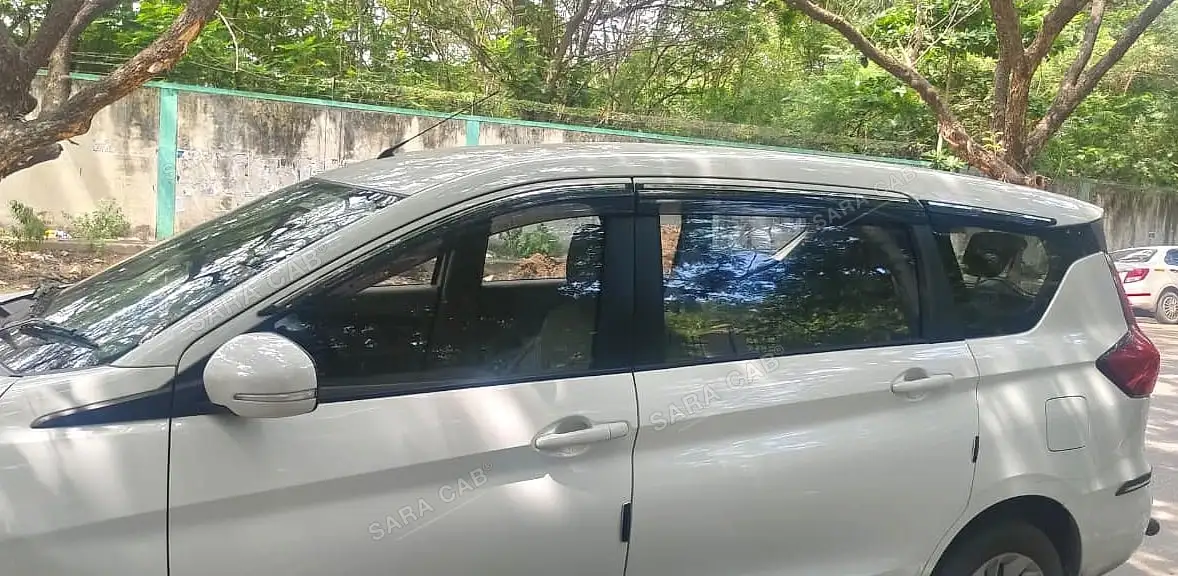 Our Ertiga from the side and rear, showing the third-row window line